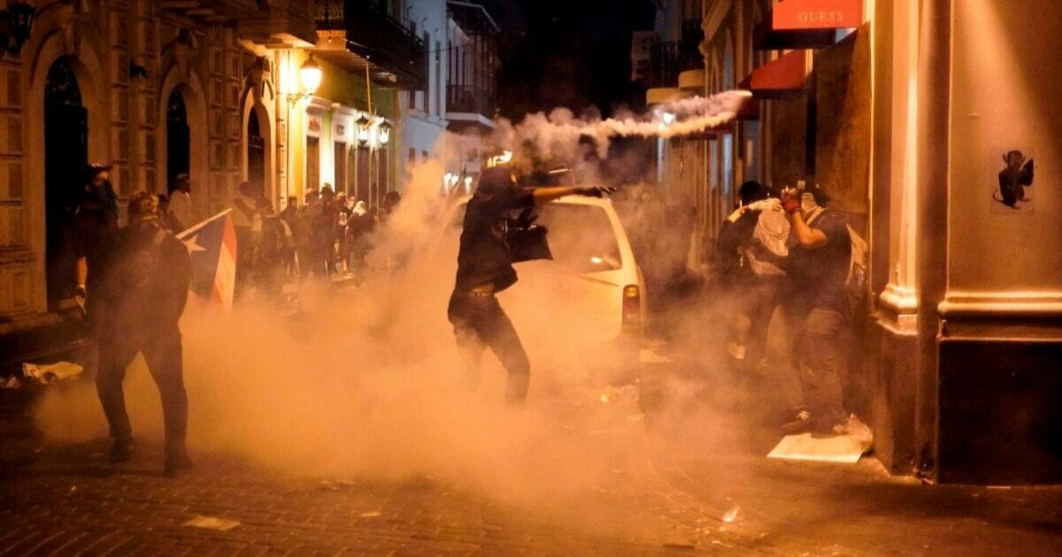 Protesters clash with police in San Juan, Puerto Rico