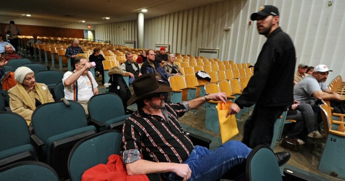 Voters deposit their ballots during Republican caucuses at a school in Des Moines, Iowa