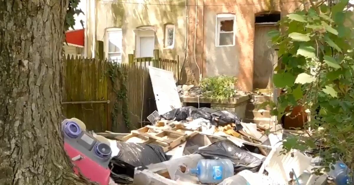 Trash piles up in a Baltimore neighborhood.