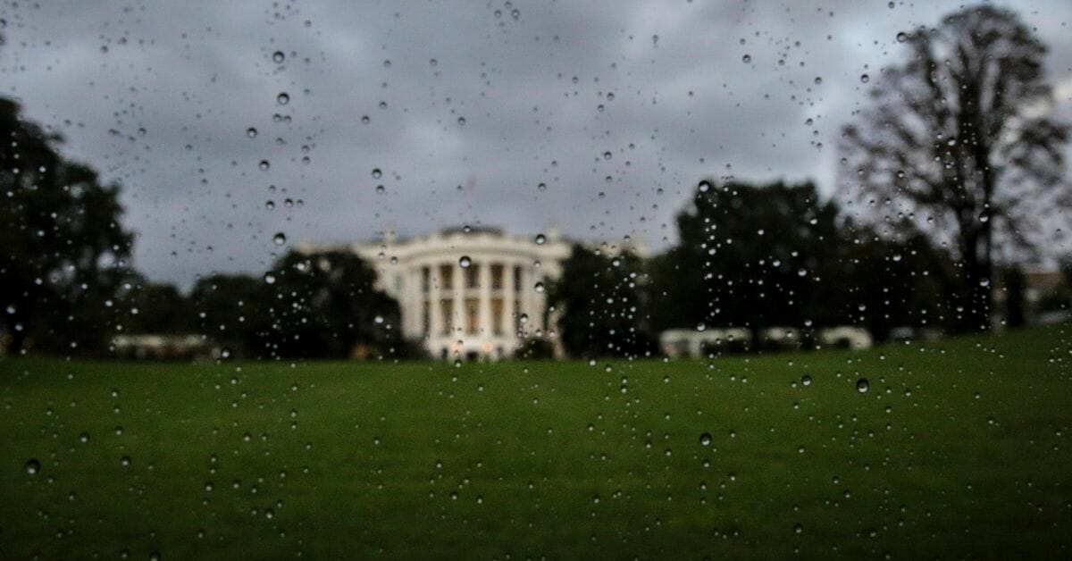 WASHINGTON, DC - SEPTEMBER 17: (AFP OUT) The South Lawn of the White House is seen from a car window covered with rain drops as the President Donald Trump's motorcade heads to the Trump International Hotel on September 17, 2018 in Washington, DC. (Photo by Oliver Contreras-Pool/Getty Images)