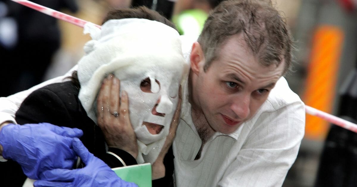 Londoners seek shelter after a series of terrorist attacks on July 7, 2005