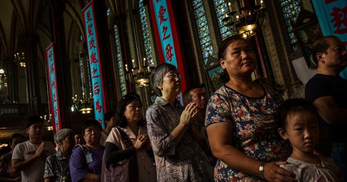 Chinese Catholics worship at a church in Beijing