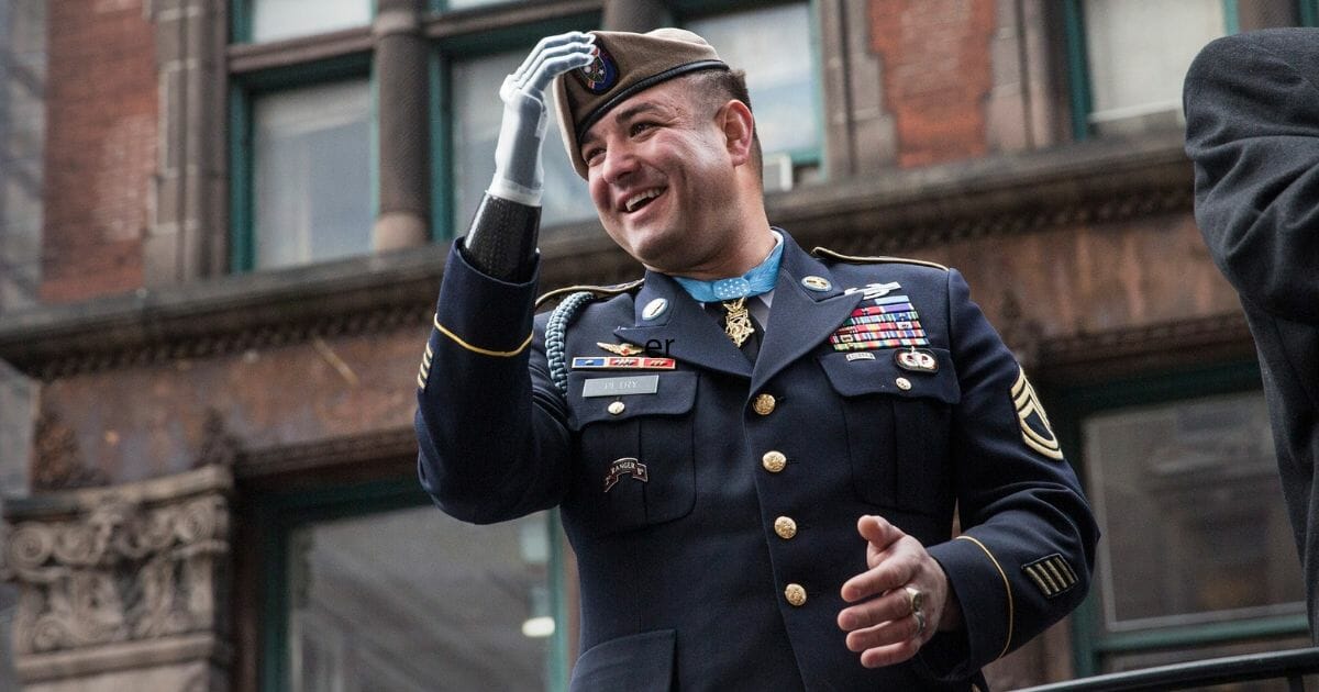 Sergeant First Class Leroy Petry, a Medal of Honor recipient and veteran of the war in Afghanistan, waves during the Veterans Day Parade on Nov. 11, 2013, in New York City.