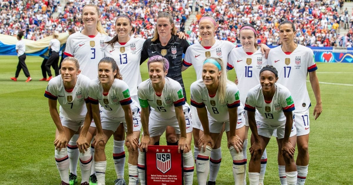 Members of the U.S. women's soccer team pose for a photo prior to World Cup Final against the Netherlands.