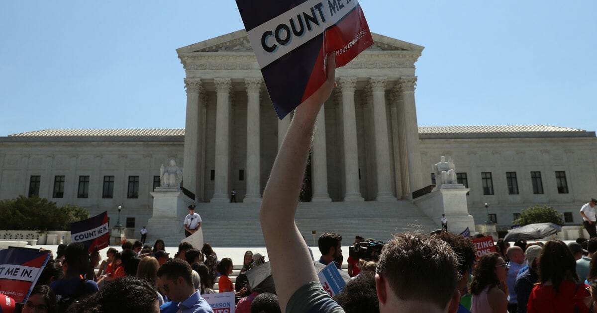 People gather in front of the U.S. Supreme Court after several decisions were handed down on June 27, 2019 in Washington, D.C.