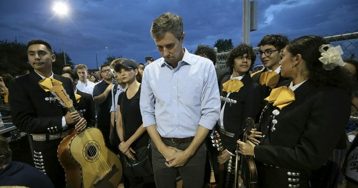 Presidential candidate and El Pasoan Beto O'Rourke prays during the Hope Border Institute prayer vigil Sunday, Aug. 4, 2019 in El Paso, Texas, a day after a mass shooting at a Walmart store.