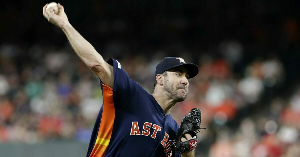 Houston Astros starting pitcher Justin Verlander throws during the first inning of a baseball game against the Seattle Mariners.