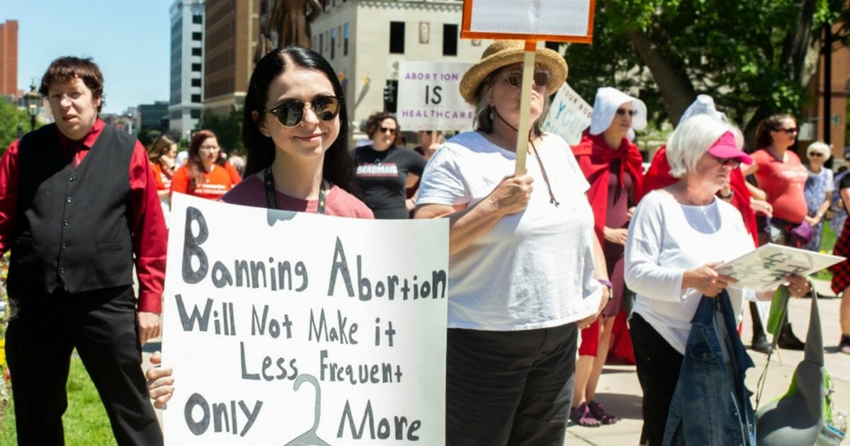 Pro-choice activists march during a rally June 22, 2019, in Lansing Mich.