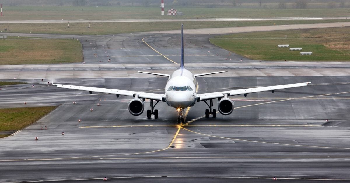 Airplane grounded by stormy weather.