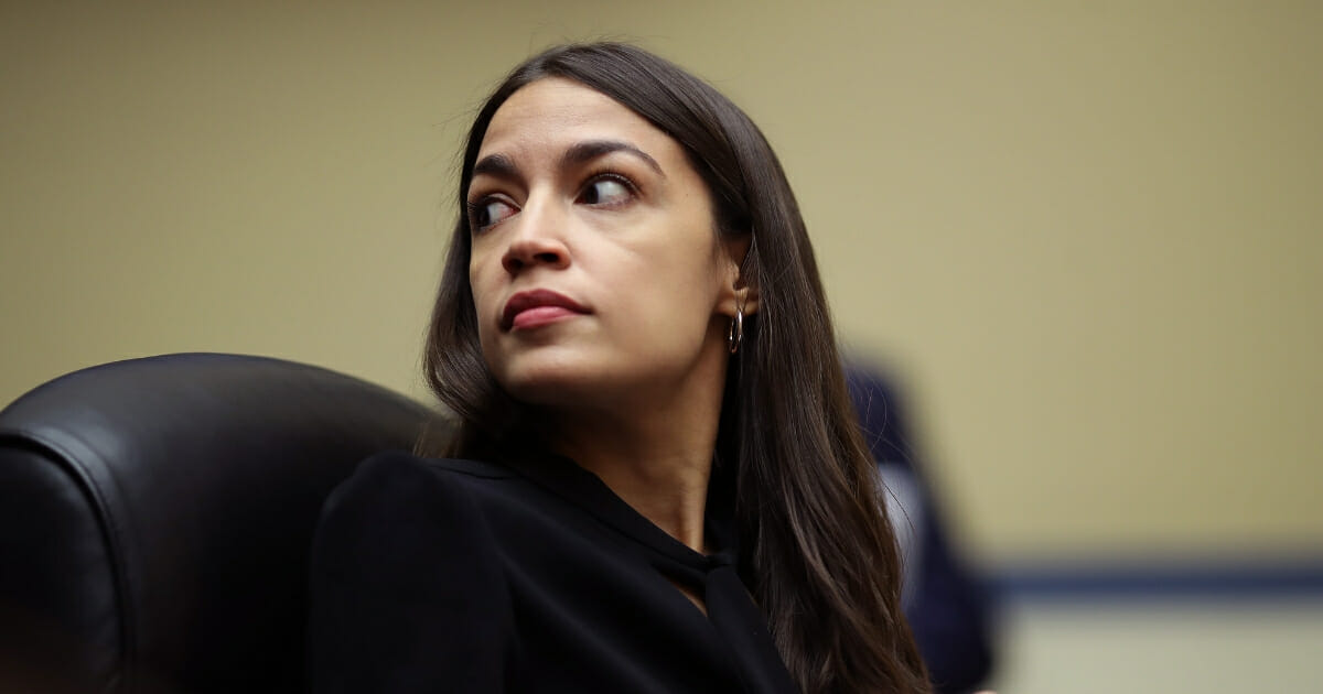 Rep. Alexandria Ocasio-Cortez (D-NY) listens to testimony from acting Homeland Security Secretary Kevin McAleenan while he testifies before the House Oversight and Reform Committee on July 18, 2019, in Washington, D.C.