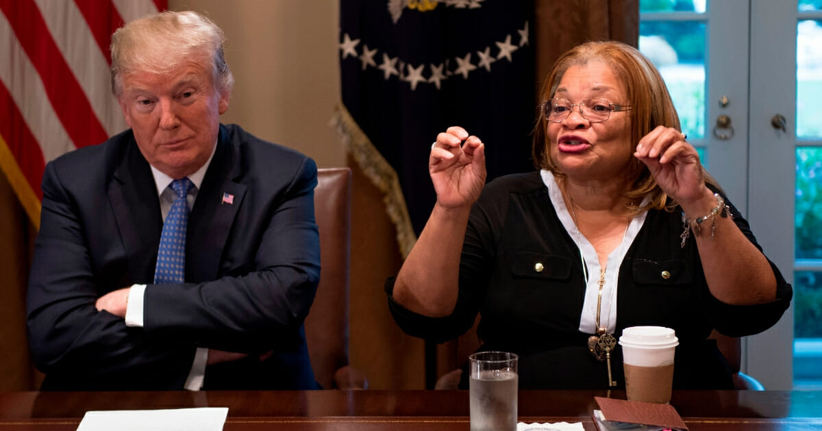 President Donald Trump listens to Dr. Alveda King, niece of Dr. Martin Luther King Jr., during a meeting with inner city pastors at the White House in Washington, D.C., on Aug. 1, 2018.