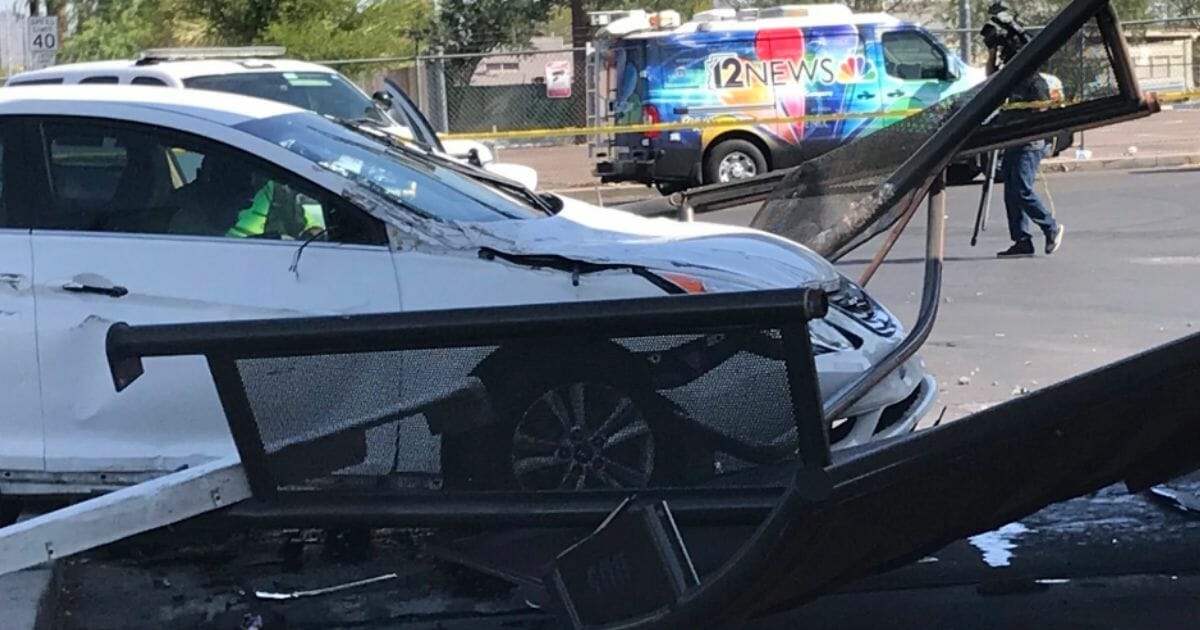 A car narrowly missed pedestrians as it demolished a bus stop shelter in Phoenix.