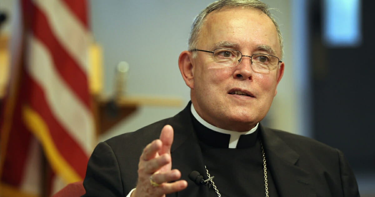 Charles Chaput, then the Catholic archbishop of Denver, answers questions at a news conference on July 20, 2011, in Denver.
