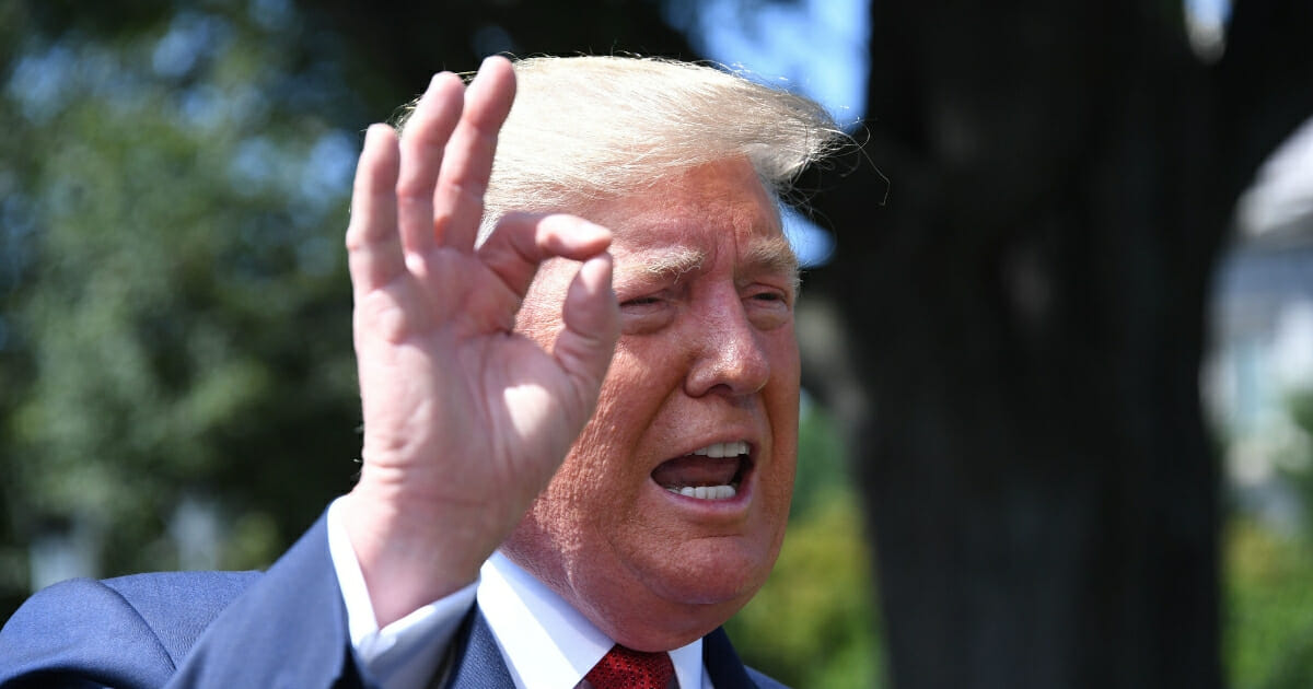 President Donald Trump speaks to the media as he departs the White House in Washington, D.C., on Aug. 21, 2019.