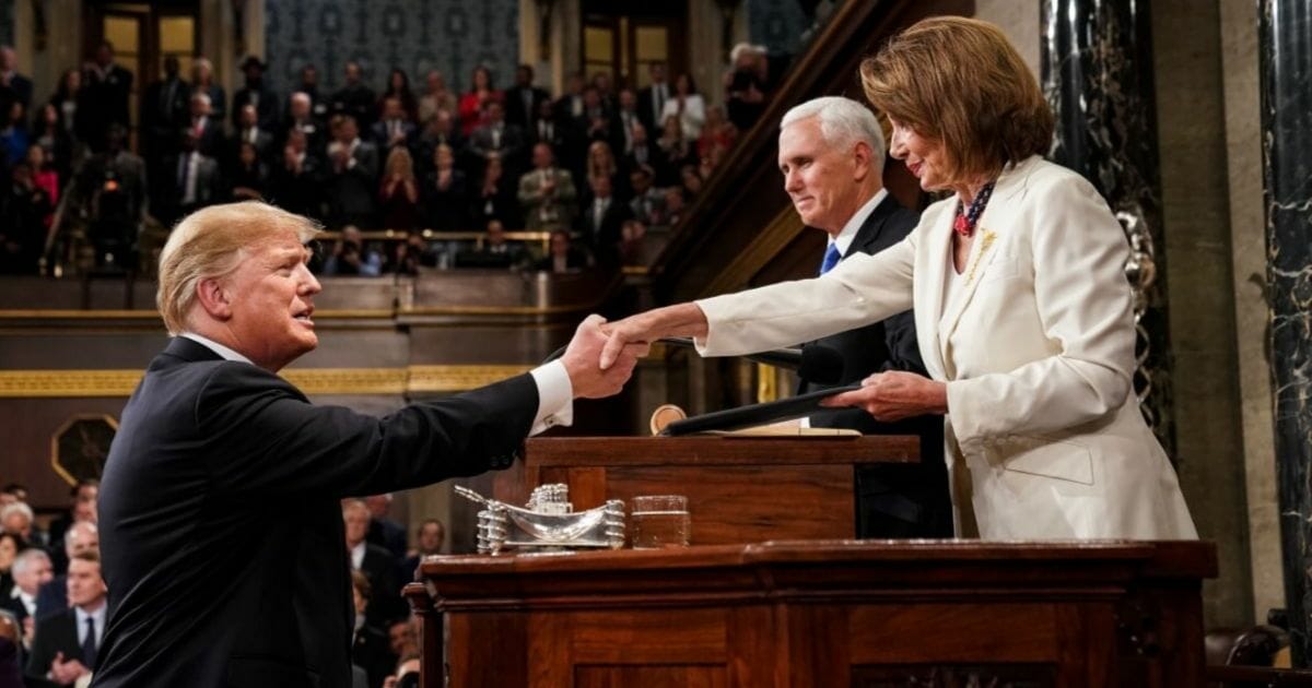 U.S. President Donald Trump shakes hands with Speaker of the House Nancy Pelosi while joined by Vice President Mike Pence before delivering the State of the Union address in the chamber of the U.S. House of Representatives at the U.S. Capitol Building on Feb. 5, 2019.