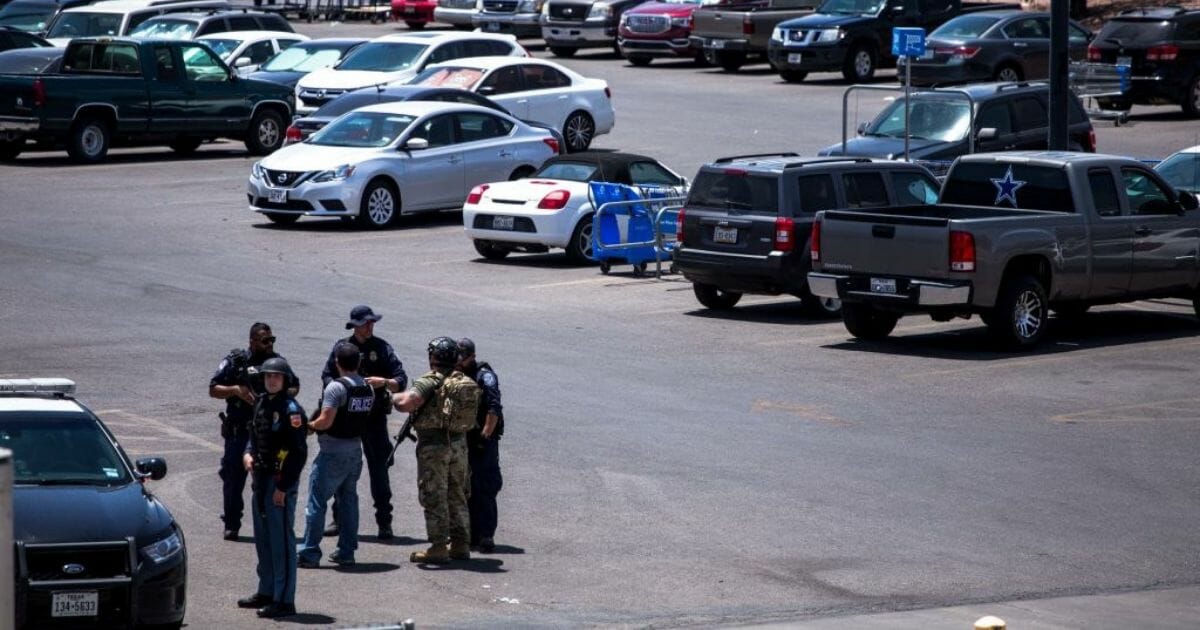 Law enforcement agencies respond to a shooting at a Walmart near Cielo Vista Mall in El Paso, Texas, Saturday, Aug. 3, 2019