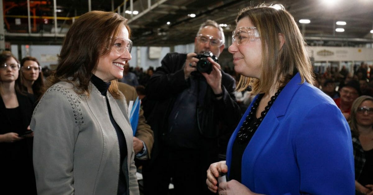 General Motors CEO Mary Barra, left, speaks with Michigan Rep. Elissa Slotkin on March 22, 2019, in Lake Orion, Mich.