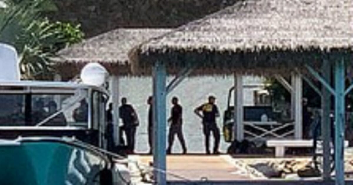 FBI agents on an island pier.
