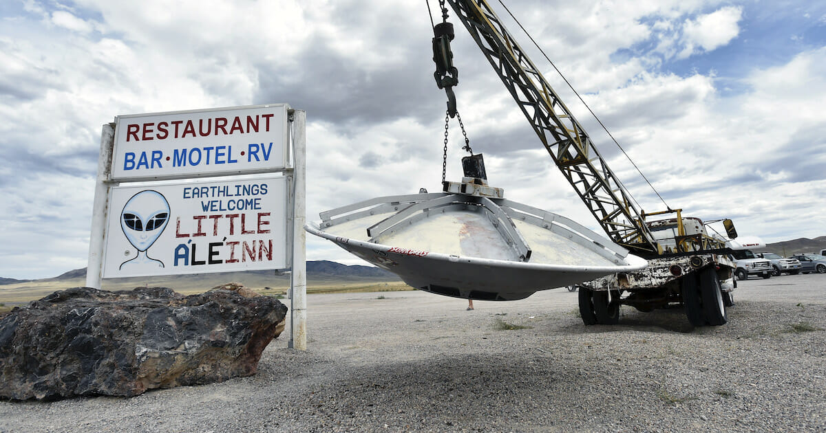 Roadside artwork featuring a tow truck and a flying saucer is displayed at the Little A'le' Inn restaurant and gift shop on July 22 in Rachel, Nevada.