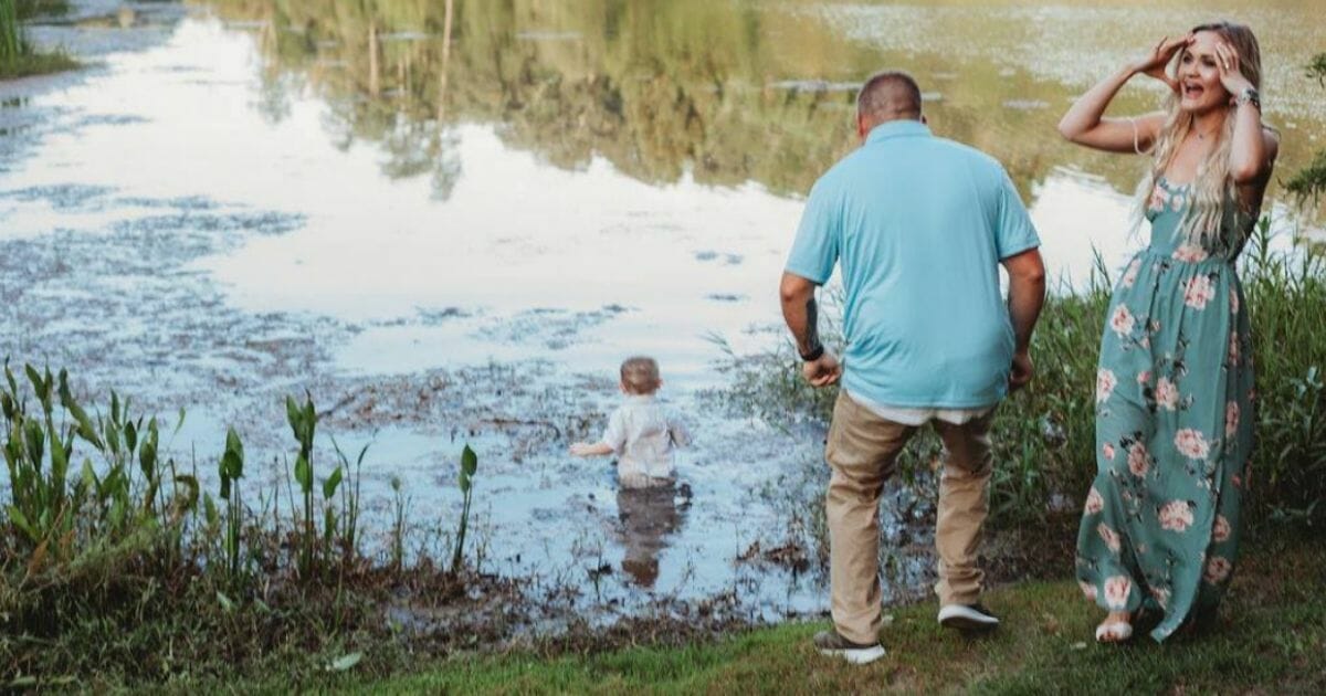 Two-year-old Lincoln decided to go for a dip in the pond during a family photo shoot.