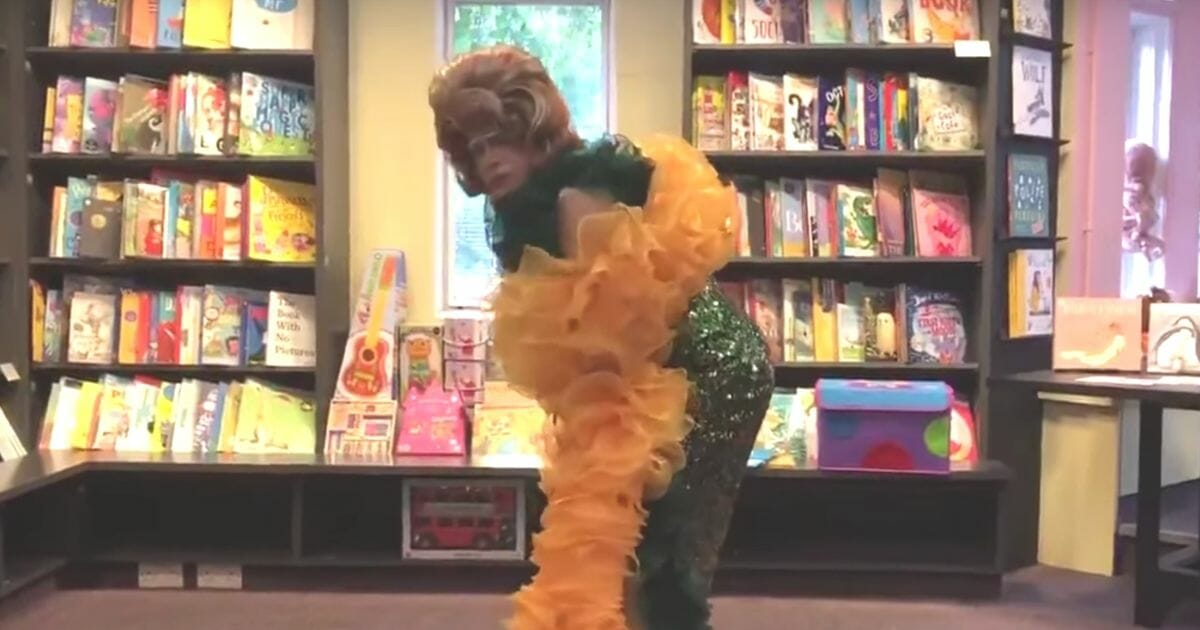 Drag Queen Mama G twerks at a library in front of children.