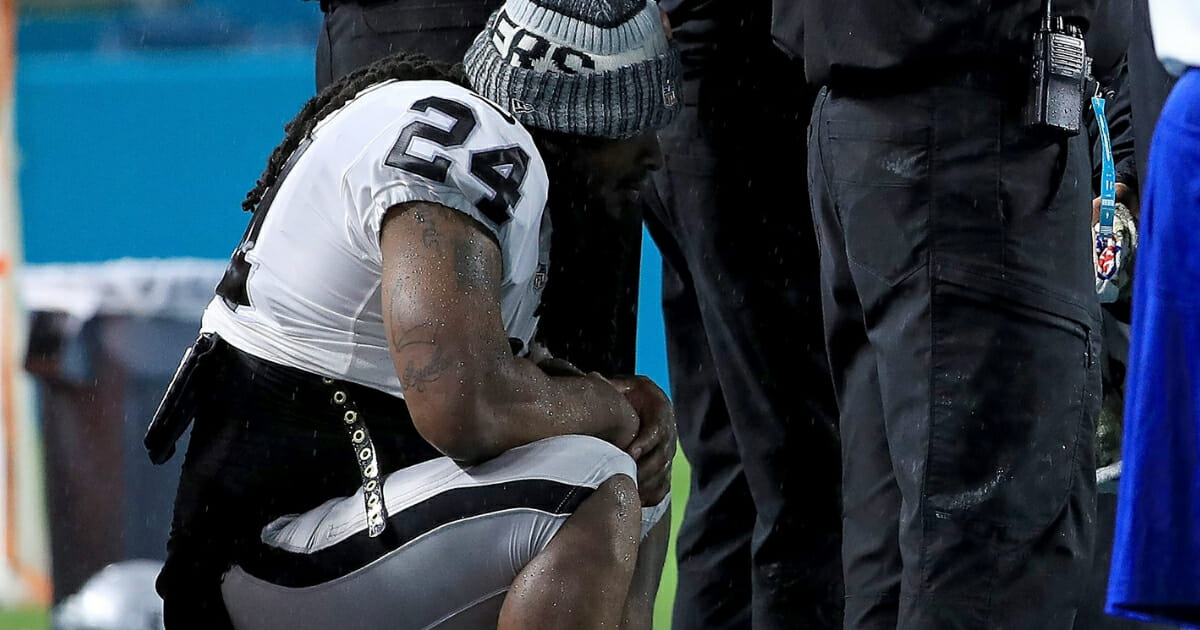 Marshawn Lynch #24 of the Oakland Raiders sits for the national anthem during a game against the Miami Dolphins at Hard Rock Stadium on Nov. 5, 2017 in Miami Gardens, Florida.