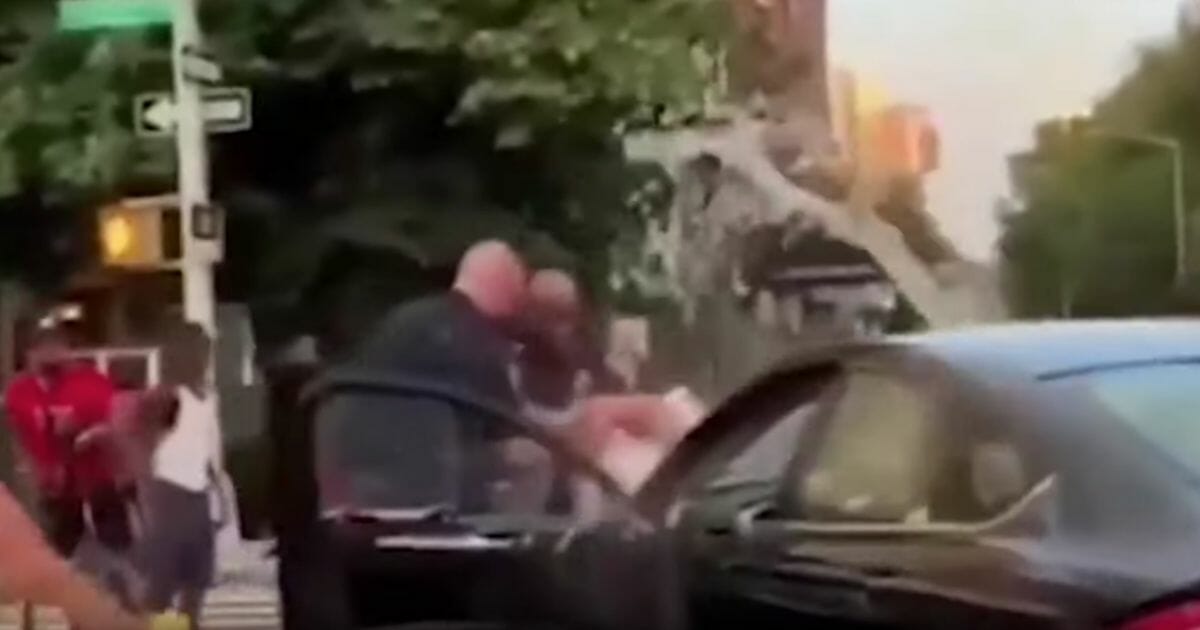 New York police officers in Queens were doused with water in July while trying to make an arrest.