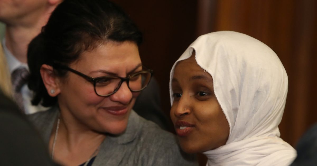 Reps. Rashida Tlaib and Ilhan Omar attend a news conference on March 13, 2019.
