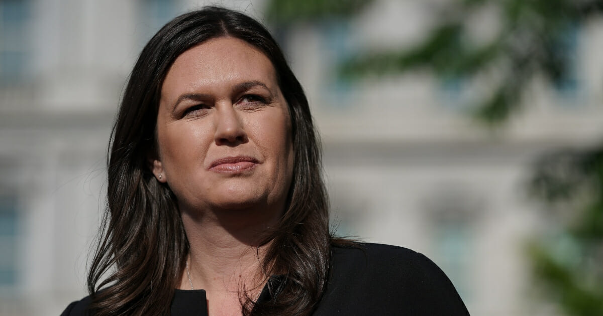 Then-White House press secretary Sarah Huckabee Sanders talks to reporters after being interviewed on Fox News outside the White House on April 29, 2019, in Washington, D.C.