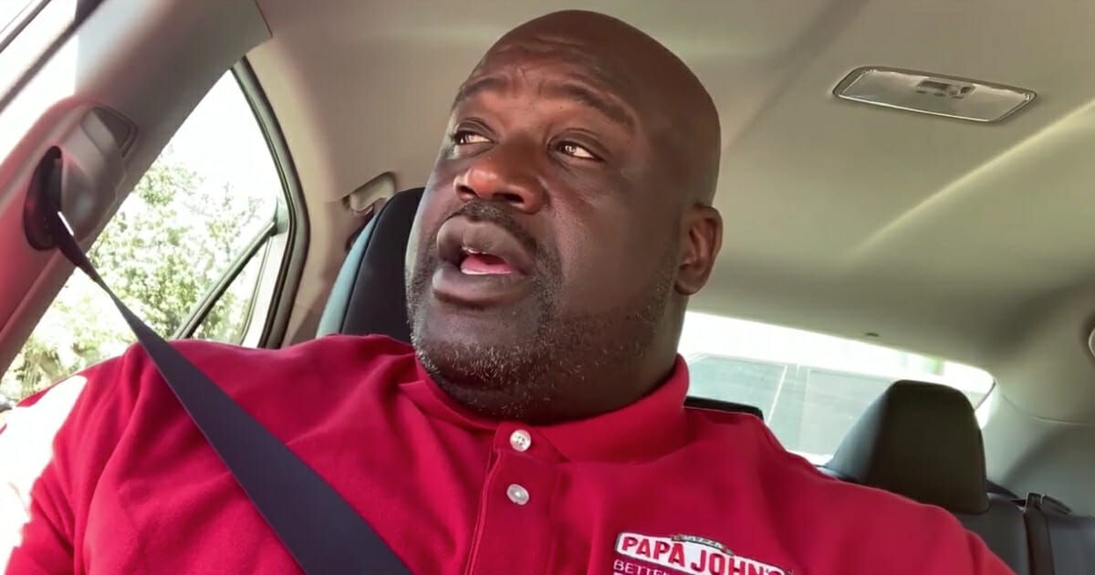 NBA legend Shaquille O'Neal delivering pizzas.