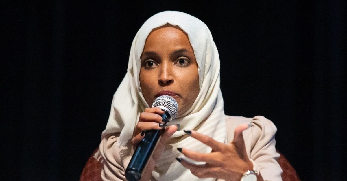 Rep. Ilhan Omar speaks on stage during a town hall meeting at Sabathani Community in Minneapolis in July.