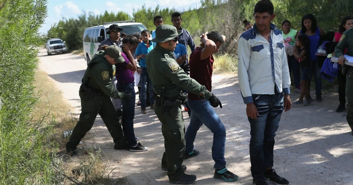 U.S. Border Patrol agents take a group of Central American asylum seekers into custody on June 2018 near McAllen, Texas.