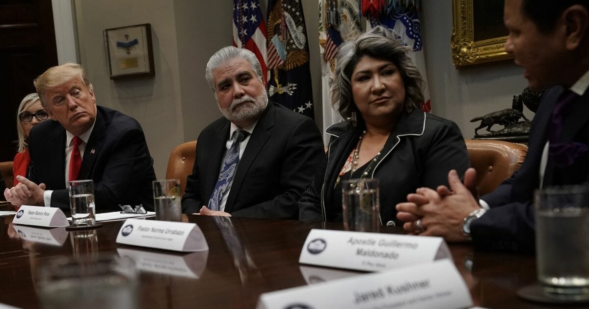 President Donald Trump listens during a meeting with Hispanic pastors at the White House on Jan. 25, 2019.