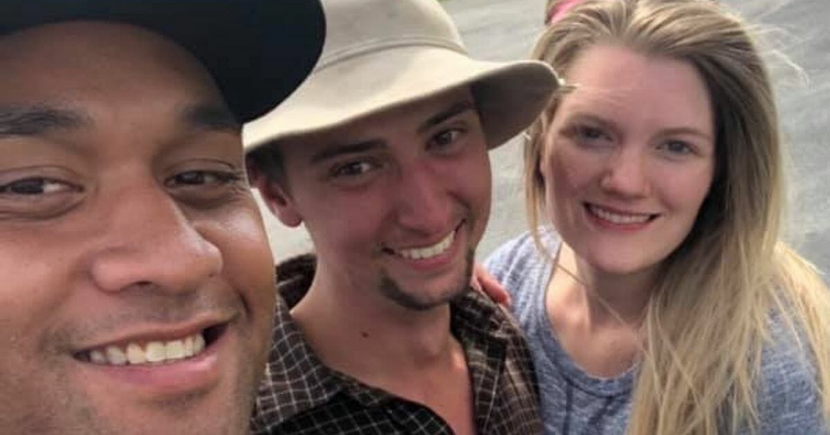 Kaden Laga, center, is reunited with his wife after being lost in the wilderness for days.