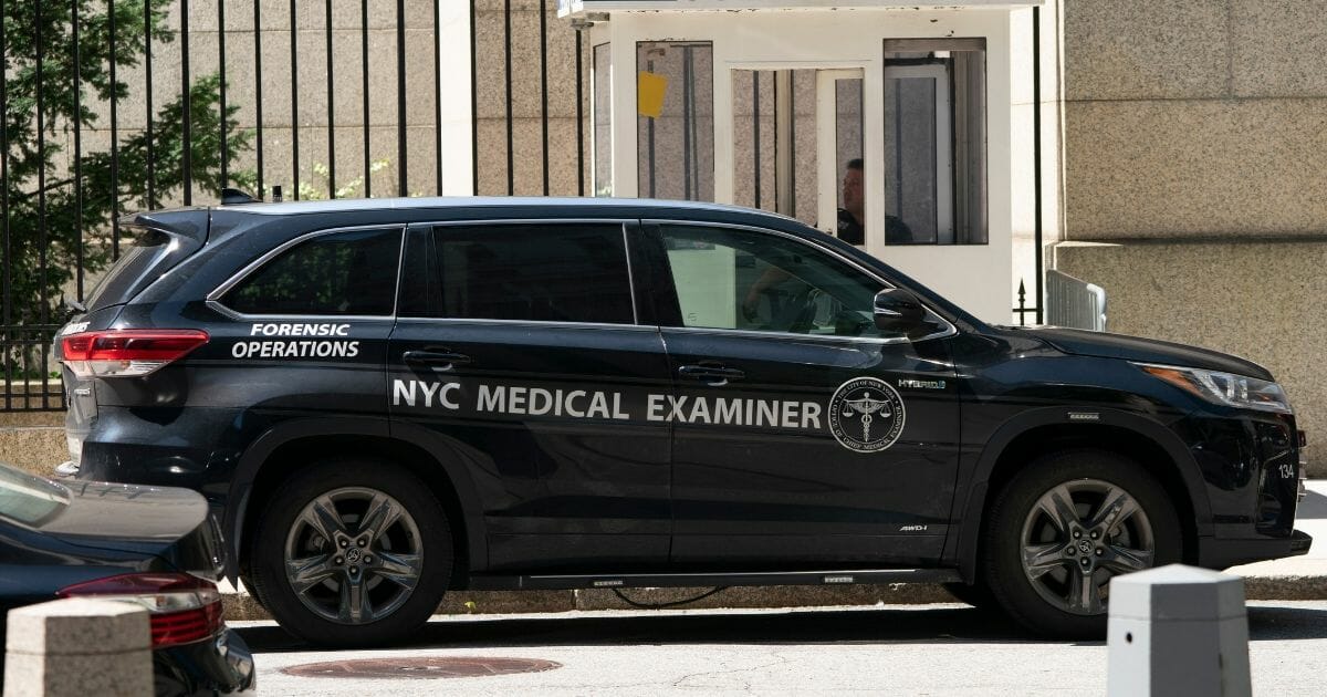 A vehicle from the New York City Medical Examiner's Office sits outside the Metropolitan Correctional Center in Manhattan on Aug. 10, the day financier and convicted sex offender Jeffrey Epstein reportedly committed suicide.