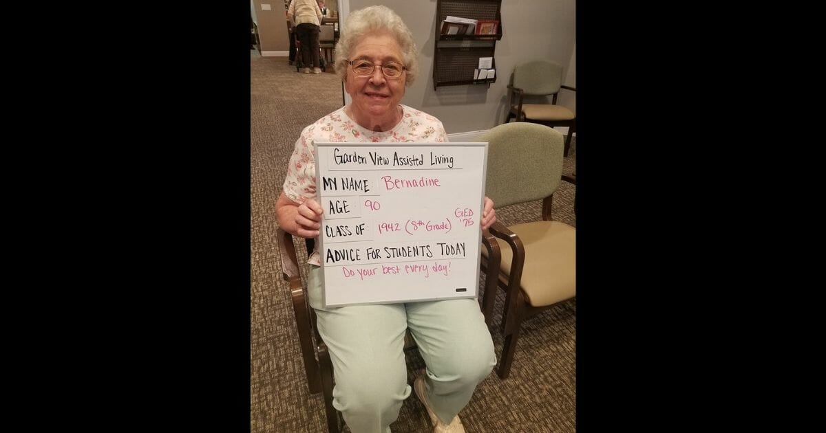 Residents like Bernadine at Garden View Assisted Living facility in Carroll, Iowa, proudly displayed their own version of a back-to-school photo shoot.