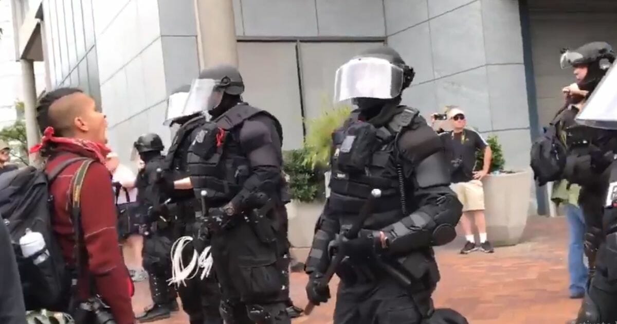 Portland police protect a small conservative group.