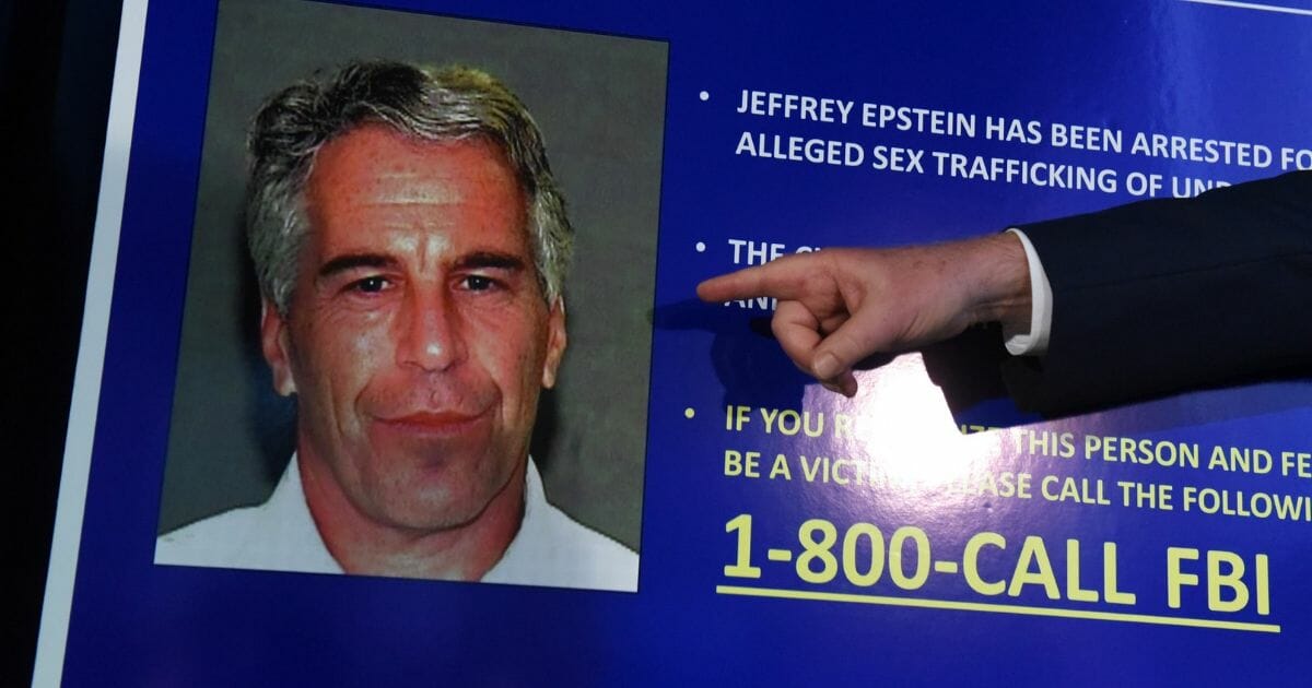 Jeffrey Epstein as seen on a poster while charges were announced against him.