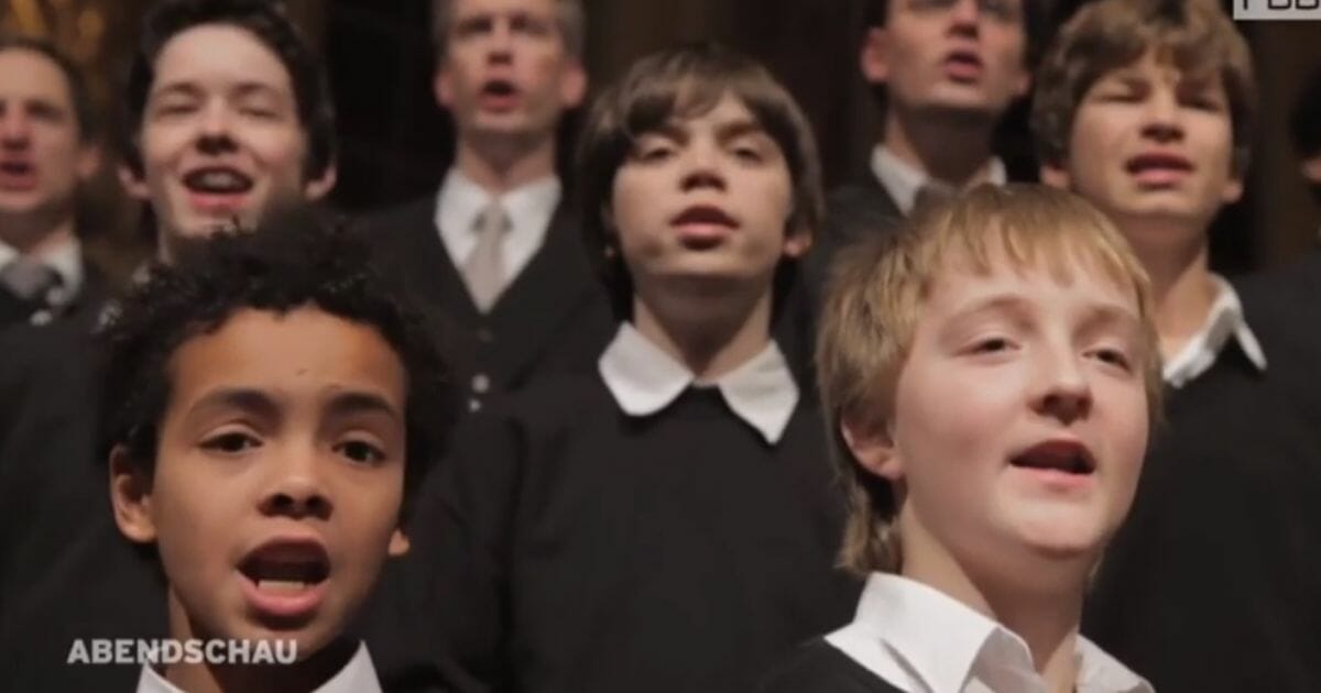 The State and Cathedral Boys' Choir in the middle of a song.