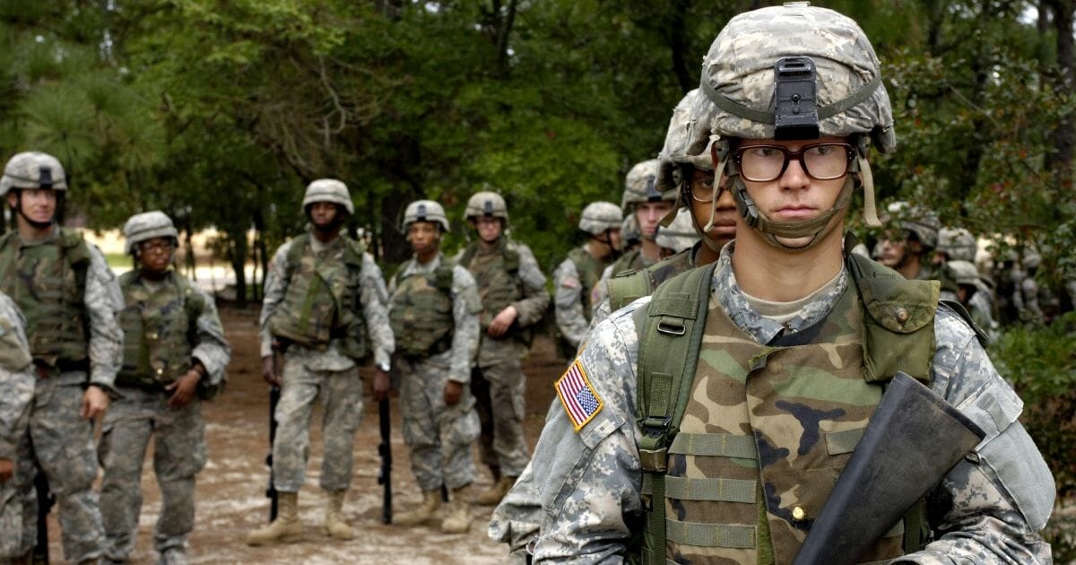 U.S. Army privates wait their turn to go through the convoy live-fire course during Army basic training at Fort Jackson, S.C., Sept. 19, 2006.