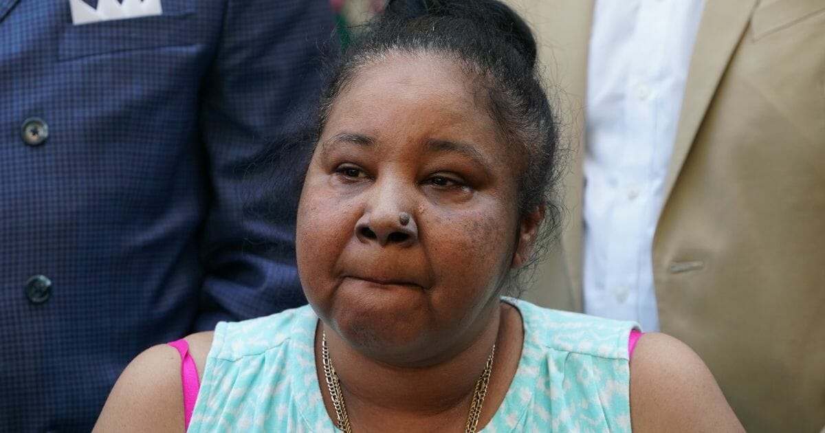 Eric Garner's widow Esaw Snipes reacts outside the Eastern District of New York July 16, 2019.
