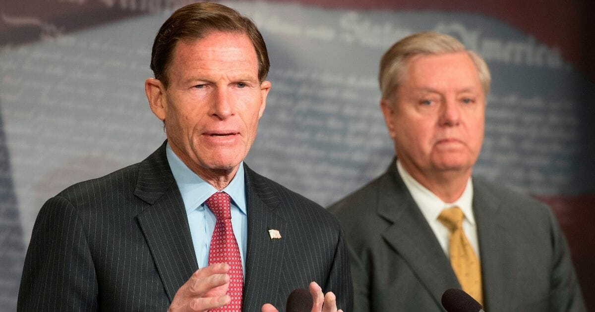 US Senator Lindsey Graham, right, and US Senator Richard Blumenthal, left, explain Extreme Risk Protection Orders on Capitol Hill in Washington, DC, on March 8, 2018.