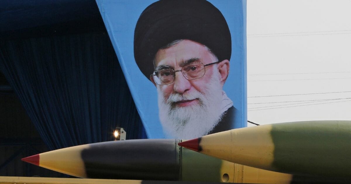 An Iranian military truck carries surface-to-air missiles past a portrait of Iran's Supreme Leader Ayatollah Ali Khamenei during a parade on the occasion of the country's annual army day on April 18, 2018, in Tehran. President Hassan Rouhani said that Iran "does not intend any aggression" against its neighbors but will continue to produce all the weapons it needs for its defense.