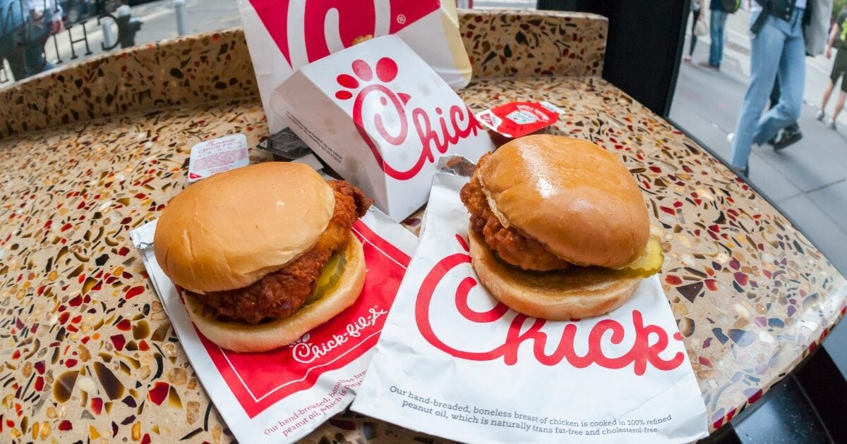 A classic Chick-Fil-A chicken sandwich and a Spicy Chicken sandwich in a Chick-Fil-A restaurant in New York.