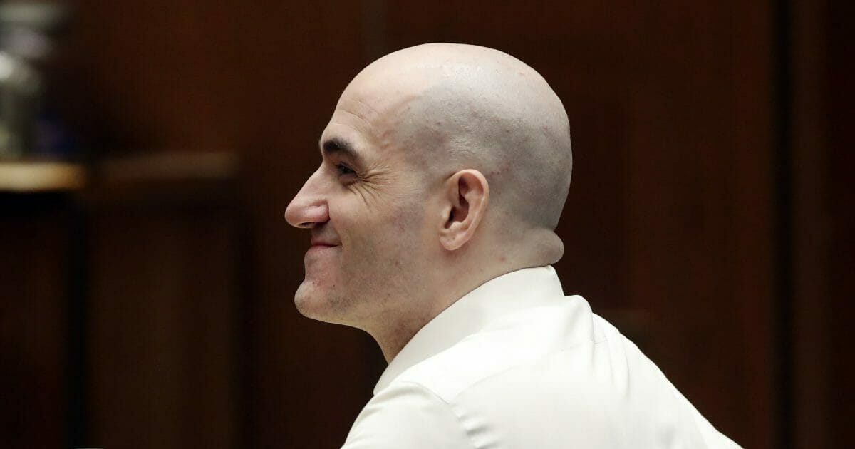 Michael Gargiulo smiles during a court appearance Tuesday, Aug. 6, 2019, in Los Angeles. Closing arguments started Tuesday in the trial of an air conditioning repairman charged with killing two Southern California women and attempting to kill a third.