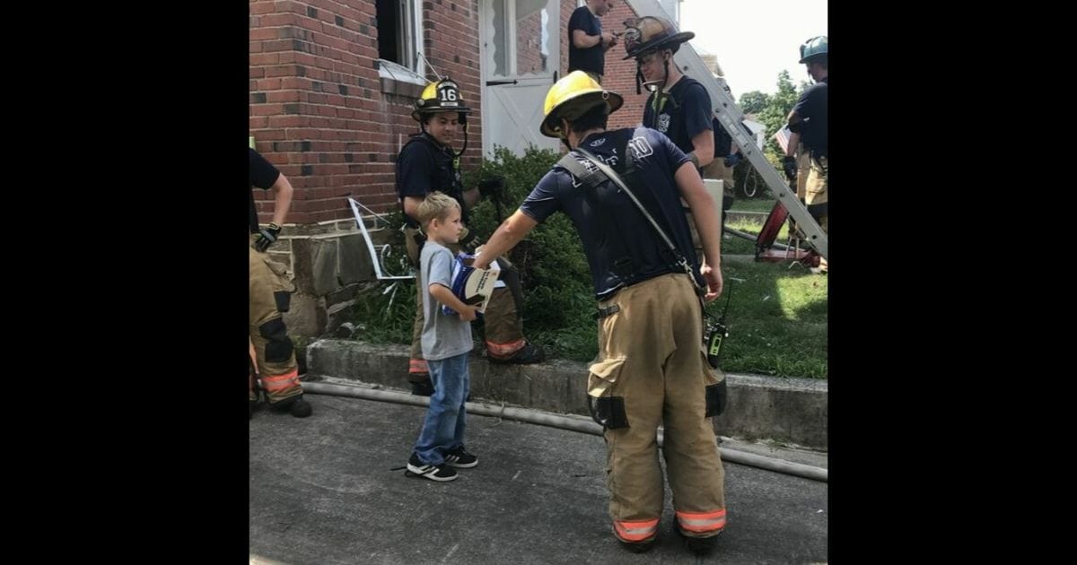 Little boy gives firefighters ice cream