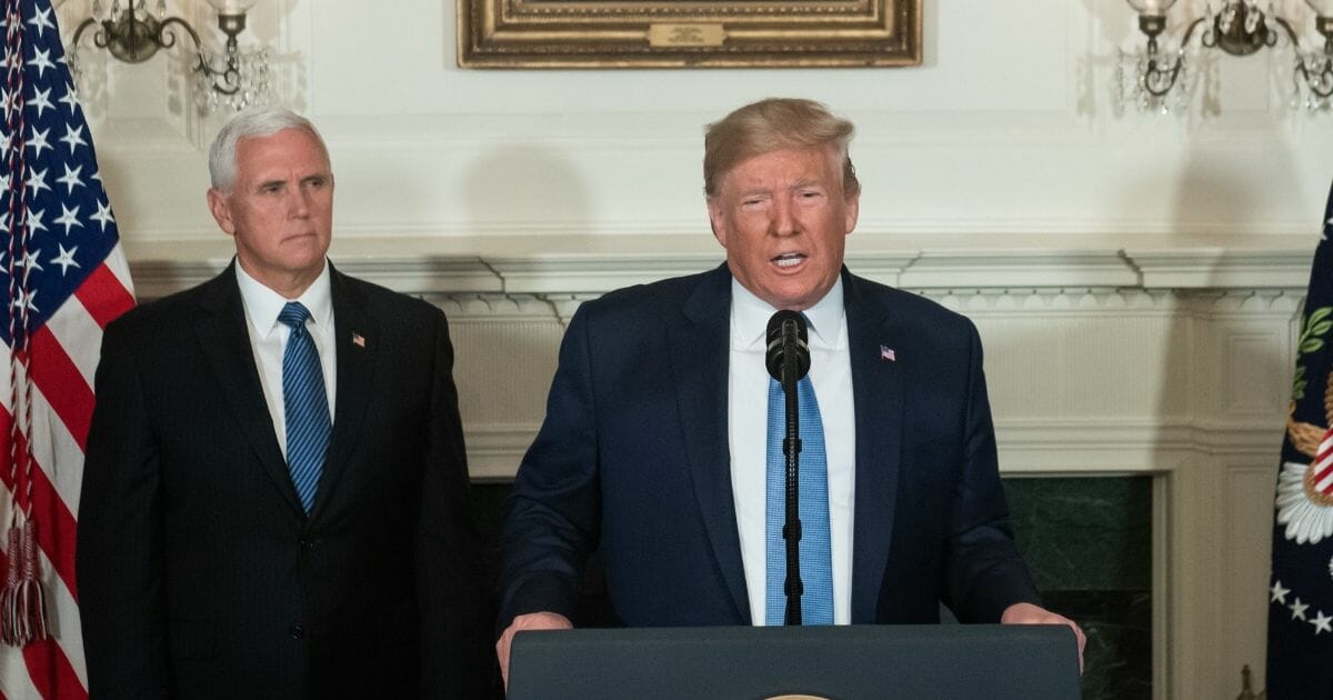 President Donald Trump speaks alongside Vice President Mike Pence about the mass shootings from the Diplomatic Reception Room of the White House in Washington, DC, August 5, 2019.