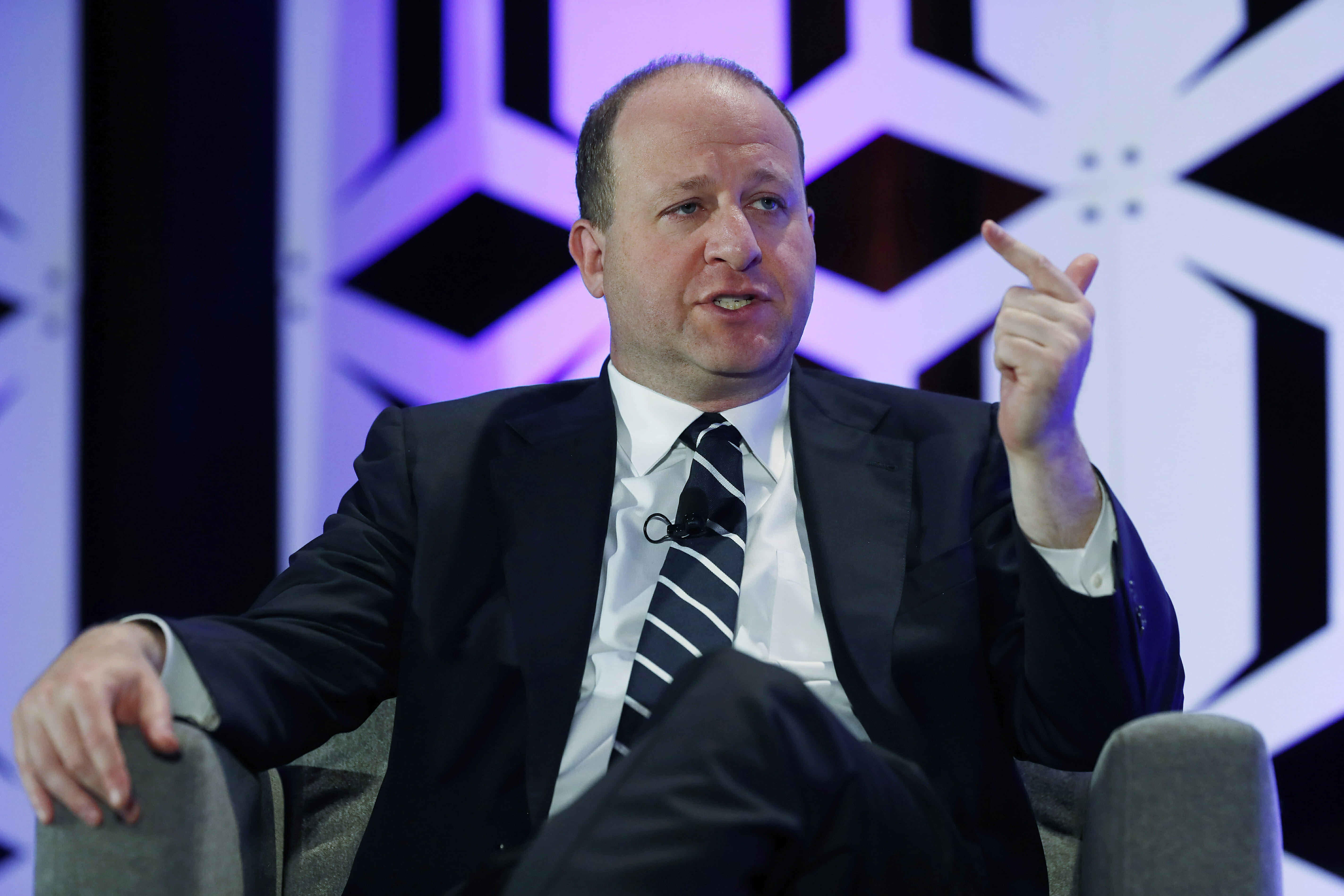 In this Aug. 28, 2019, file photo, Colorado Gov. Jared Polis speaks during an appearance at The Energy Summit in Denver.