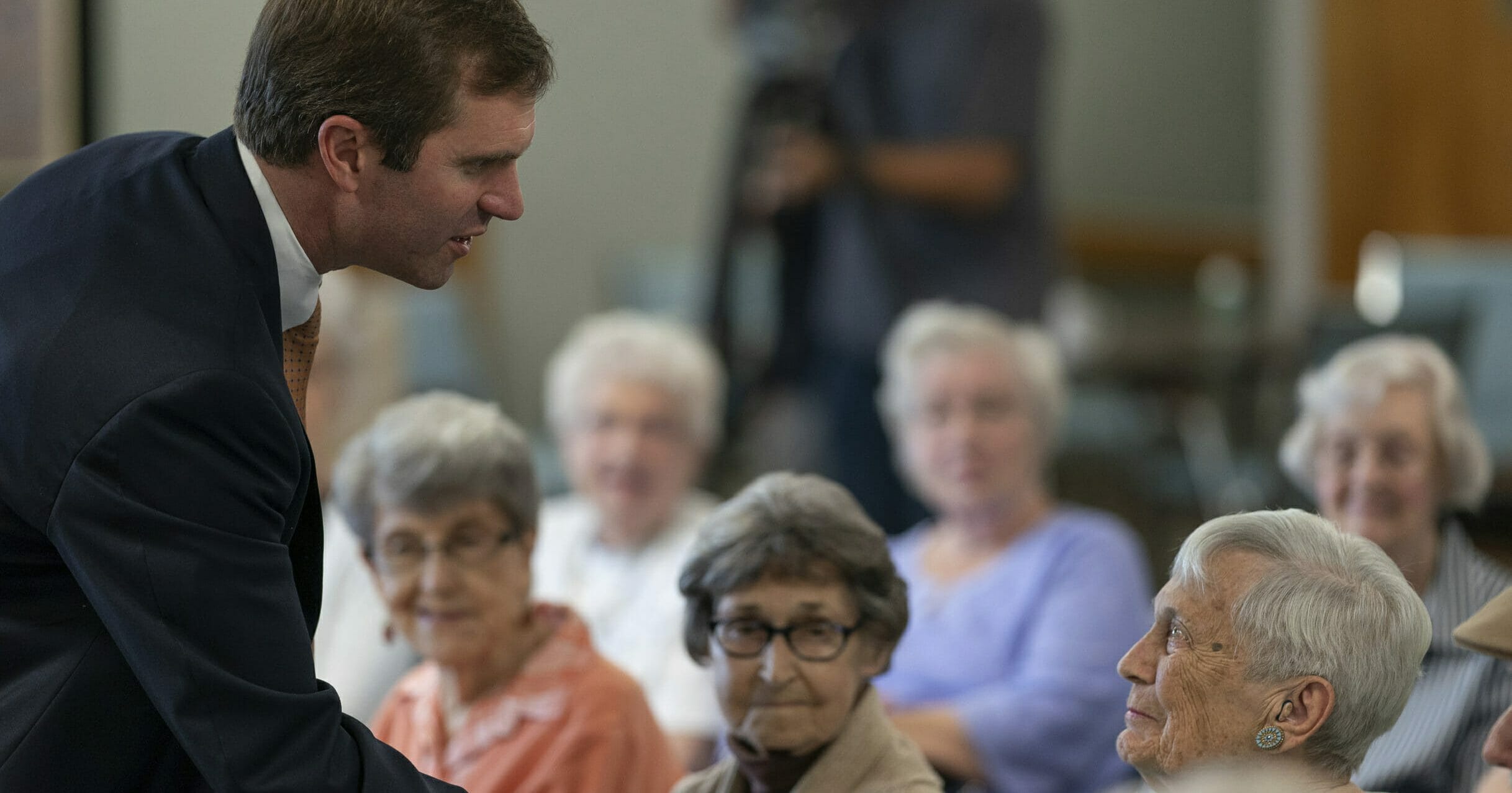 In this Thursday, Sept. 27, 2019, file photo, Kentucky Attorney General and Democratic gubernatorial candidate Andy Beshear greets residents at Sayre Christina Village Senior Living Center in Lexington, Ky