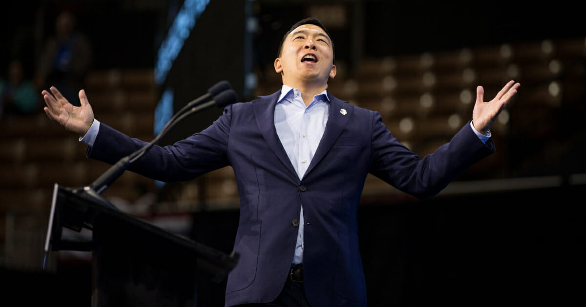 Democratic presidential candidate and entrepreneur Andrew Yang reacts as he goes on stage during the New Hampshire Democratic Party Convention at the SNHU Arena on Sept. 7, 2019, in Manchester, New Hampshire.